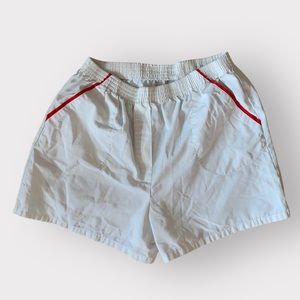 Vintage white size large flat front unisex shorts with red piping